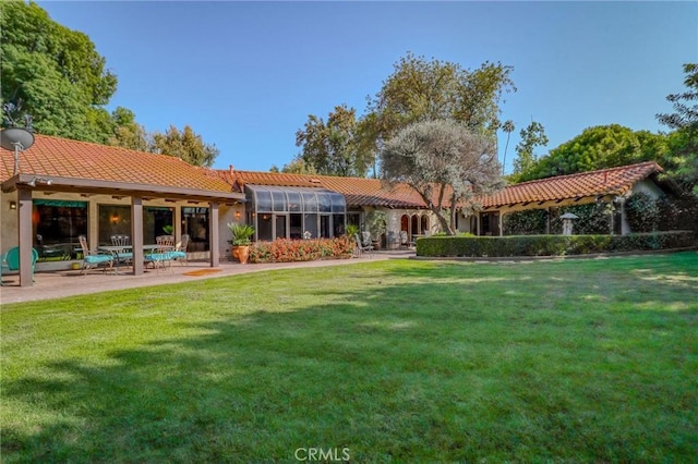 2033 Benbow Pl, Riverside, CA 92506 - rear view of house featuring a tiled roof, a lawn, a patio, and stucco siding