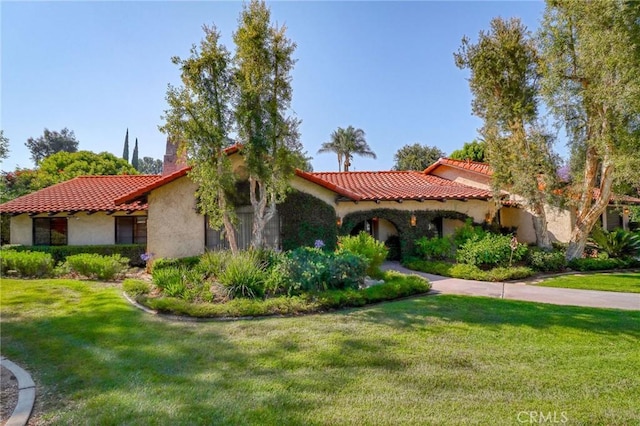 2033 Benbow Pl, Riverside, CA 92506 - mediterranean / spanish-style home featuring stucco siding, a front yard, and a tiled roof