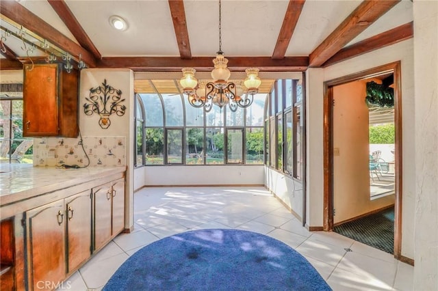 2033 Benbow Pl, Riverside, CA 92506 - unfurnished dining area featuring beamed ceiling, light tile patterned flooring, and a chandelier