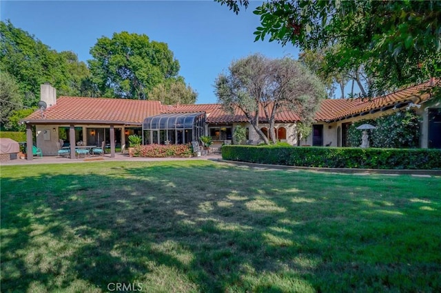 2033 Benbow Pl, Riverside, CA 92506 - view of front of house featuring a tiled roof, a front yard, and a chimney