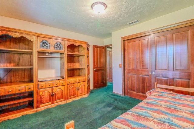 2033 Benbow Pl, Riverside, CA 92506 - bedroom with dark carpet, a closet, and a textured ceiling