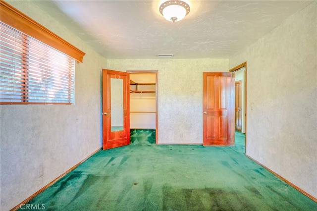 2033 Benbow Pl, Riverside, CA 92506 - unfurnished bedroom featuring carpet floors, a textured wall, and a closet