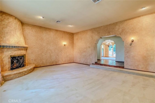 2033 Benbow Pl, Riverside, CA 92506 - unfurnished living room featuring carpet, arched walkways, a high end fireplace, and recessed lighting