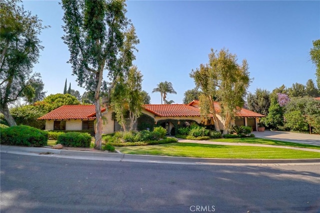 2033 Benbow Pl, Riverside, CA 92506 - mediterranean / spanish-style home featuring a tile roof, driveway, and a front yard