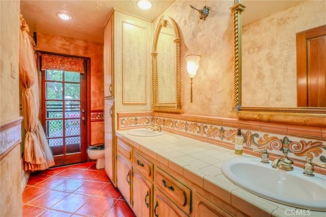 2033 Benbow Pl, Riverside, CA 92506 - full bath featuring double vanity, tile patterned floors, and wallpapered walls