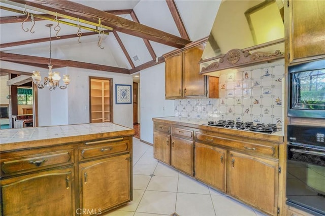 2033 Benbow Pl, Riverside, CA 92506 - kitchen with premium range hood, oven, a chandelier, decorative backsplash, and tile counters