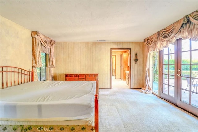 2033 Benbow Pl, Riverside, CA 92506 - unfurnished bedroom featuring access to exterior, carpet, french doors, and connected bathroom