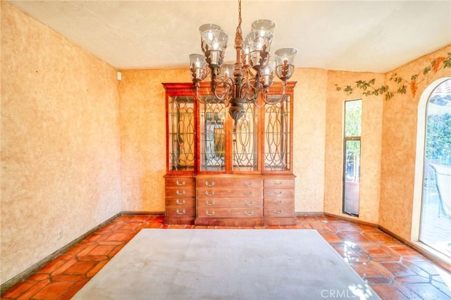 2033 Benbow Pl, Riverside, CA 92506 - unfurnished dining area with a chandelier