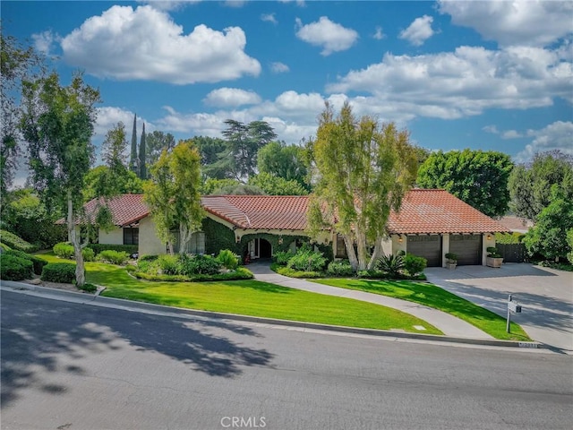 2033 Benbow Pl, Riverside, CA 92506 - mediterranean / spanish-style house with a tile roof, an attached garage, concrete driveway, and stucco siding