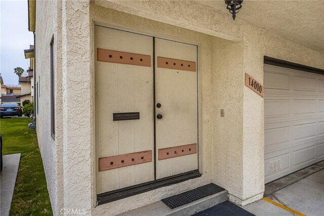 14000 Cerise Ave, Hawthorne, CA 90250 - doorway to property featuring stucco siding