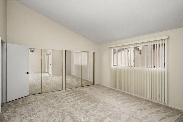 14000 Cerise Ave, Hawthorne, CA 90250 - unfurnished bedroom with two closets, carpet flooring, and high vaulted ceiling