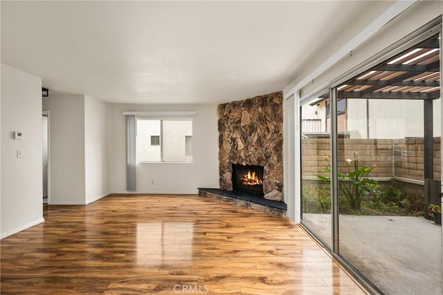 14000 Cerise Ave, Hawthorne, CA 90250 - unfurnished living room featuring wood finished floors and a fireplace
