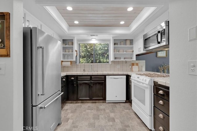 801 Vine St, Exeter, CA 93221 - kitchen featuring stainless steel appliances, open shelves, a raised ceiling, decorative backsplash, and recessed lighting