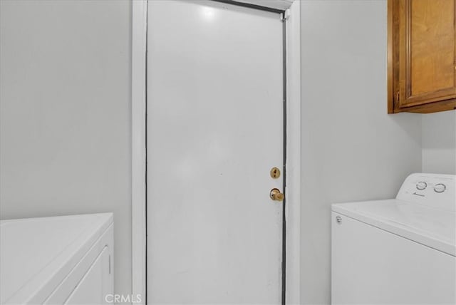 801 Vine St, Exeter, CA 93221 - laundry area with separate washer and dryer and cabinet space
