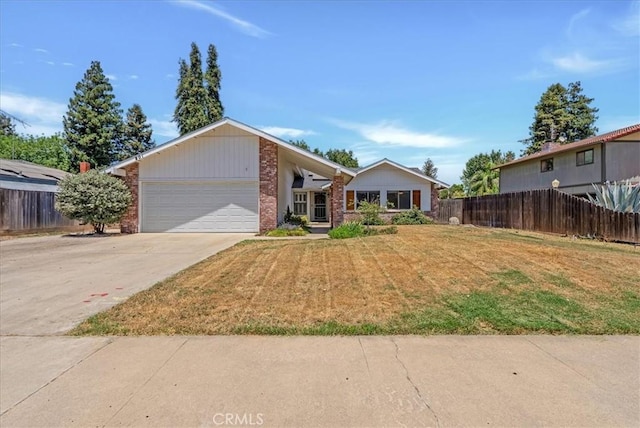 801 Vine St, Exeter, CA 93221 - mid-century home with a garage, brick siding, and concrete driveway