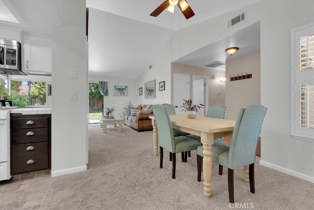 801 Vine St, Exeter, CA 93221 - dining space featuring ceiling fan, light carpet, and lofted ceiling