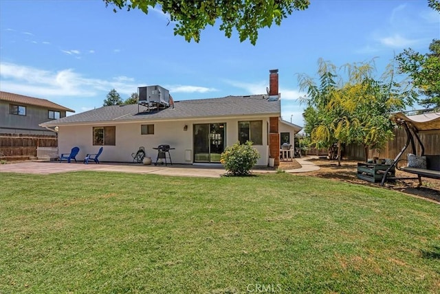 801 Vine St, Exeter, CA 93221 - back of property featuring a patio area, a fenced backyard, a chimney, and stucco siding