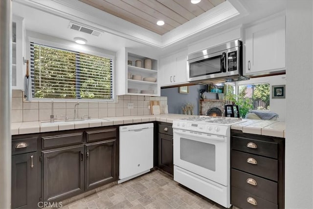 801 Vine St, Exeter, CA 93221 - kitchen with white appliances, backsplash, tile countertops, and recessed lighting