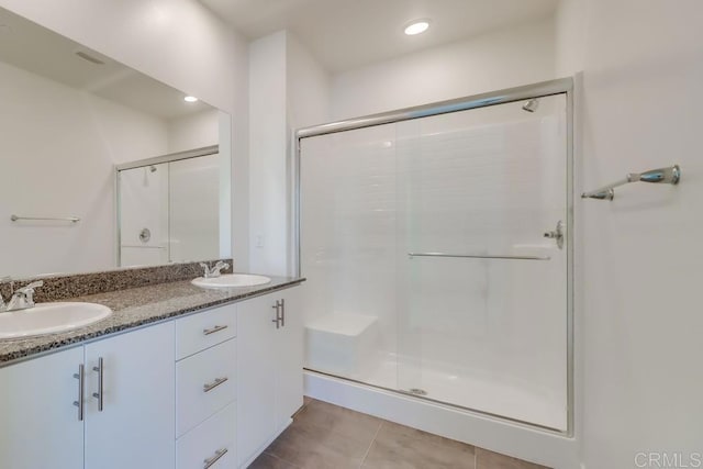 5305 Seacliff Pl Unit 5, San Diego, CA 92154 - bathroom with a stall shower, double vanity, and tile patterned flooring