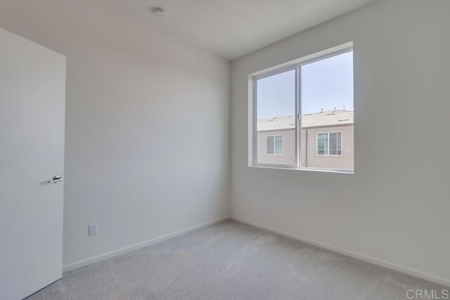 5305 Seacliff Pl Unit 5, San Diego, CA 92154 - spare room with a smoke detector and light colored carpet