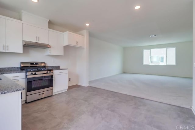 5305 Seacliff Pl Unit 5, San Diego, CA 92154 - kitchen featuring gas range, under cabinet range hood, white cabinetry, recessed lighting, and dark stone counters