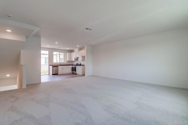 5305 Seacliff Pl Unit 5, San Diego, CA 92154 - unfurnished living room with recessed lighting and light carpet