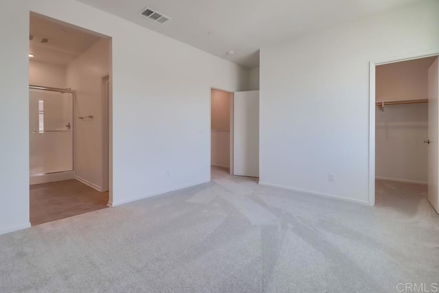 5305 Seacliff Pl Unit 5, San Diego, CA 92154 - unfurnished bedroom with carpet flooring, a spacious closet, and ensuite bath