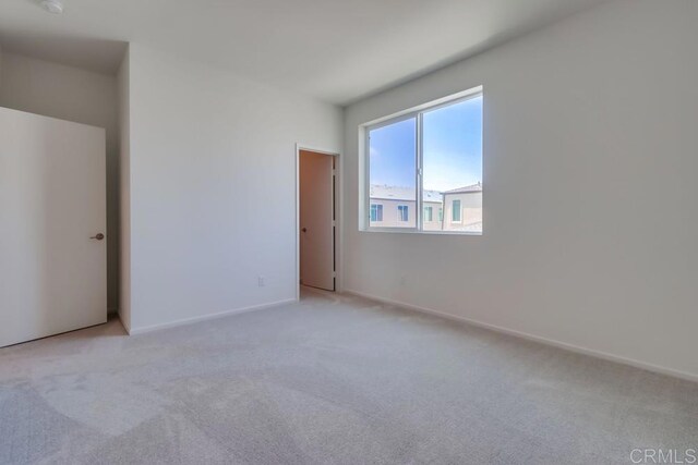 5305 Seacliff Pl Unit 5, San Diego, CA 92154 - unfurnished bedroom with light carpet and baseboards
