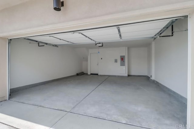 5305 Seacliff Pl Unit 5, San Diego, CA 92154 - garage featuring a garage door opener and electric panel
