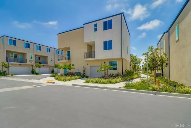 5305 Seacliff Pl Unit 5, San Diego, CA 92154 - view of building exterior with an attached garage