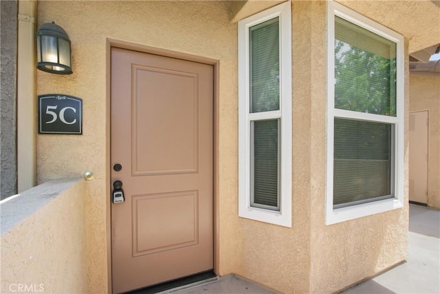 19431 Rue De Valore Unit 5C, Lake Forest, CA 92610 - doorway to property featuring stucco siding