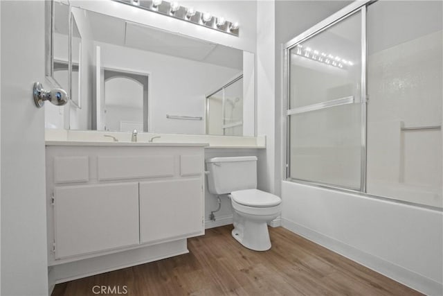 19431 Rue De Valore Unit 5C, Lake Forest, CA 92610 - bathroom featuring wood finished floors, enclosed tub / shower combo, and vanity