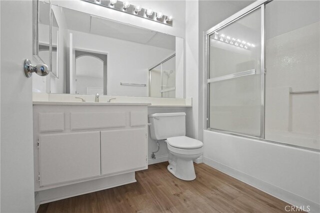 19431 Rue De Valore Unit 5C, Lake Forest, CA 92610 - bathroom with wood finished floors, enclosed tub / shower combo, and vanity