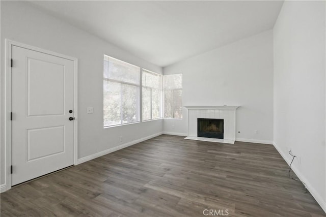 19431 Rue De Valore Unit 5C, Lake Forest, CA 92610 - unfurnished living room with a fireplace, wood finished floors, and lofted ceiling