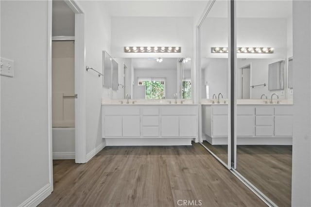 19431 Rue De Valore Unit 5C, Lake Forest, CA 92610 - bathroom featuring double vanity and wood finished floors