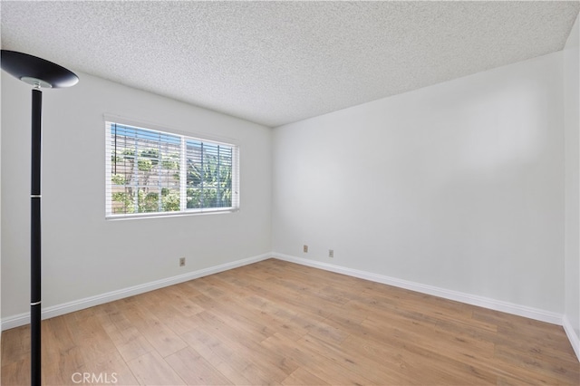1736 Park Lawn Rd, Hacienda Heights, CA 91745 - empty room featuring light wood-style flooring and a textured ceiling