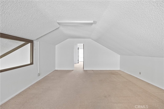 1736 Park Lawn Rd, Hacienda Heights, CA 91745 - additional living space with a textured ceiling, carpet flooring, and lofted ceiling