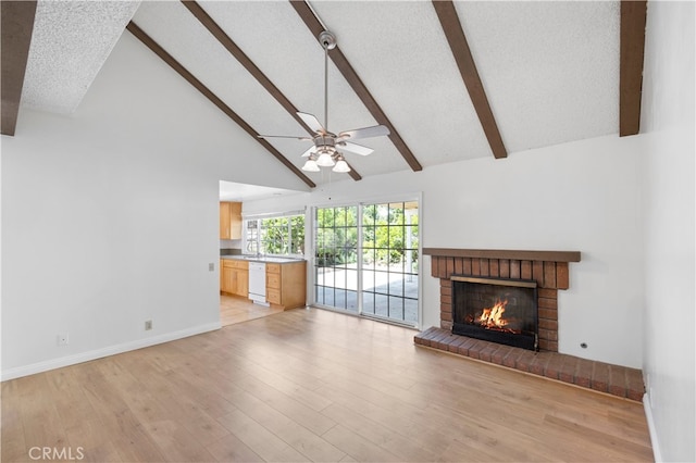 1736 Park Lawn Rd, Hacienda Heights, CA 91745 - unfurnished living room with high vaulted ceiling, beam ceiling, ceiling fan, a brick fireplace, and light wood-style flooring