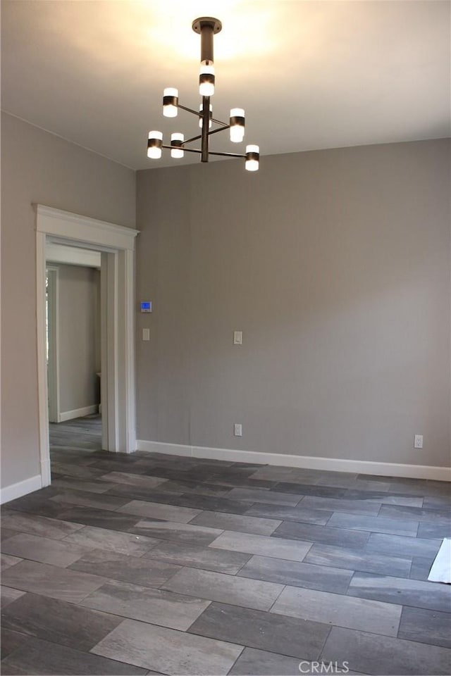 508 S Orange Ave, Santa Ana, CA 92701 - unfurnished room with a chandelier and wood finished floors