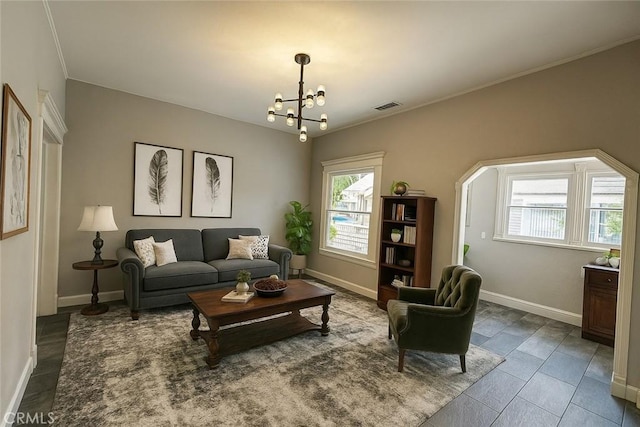 508 S Orange Ave, Santa Ana, CA 92701 - living room featuring healthy amount of natural light, a chandelier, and crown molding