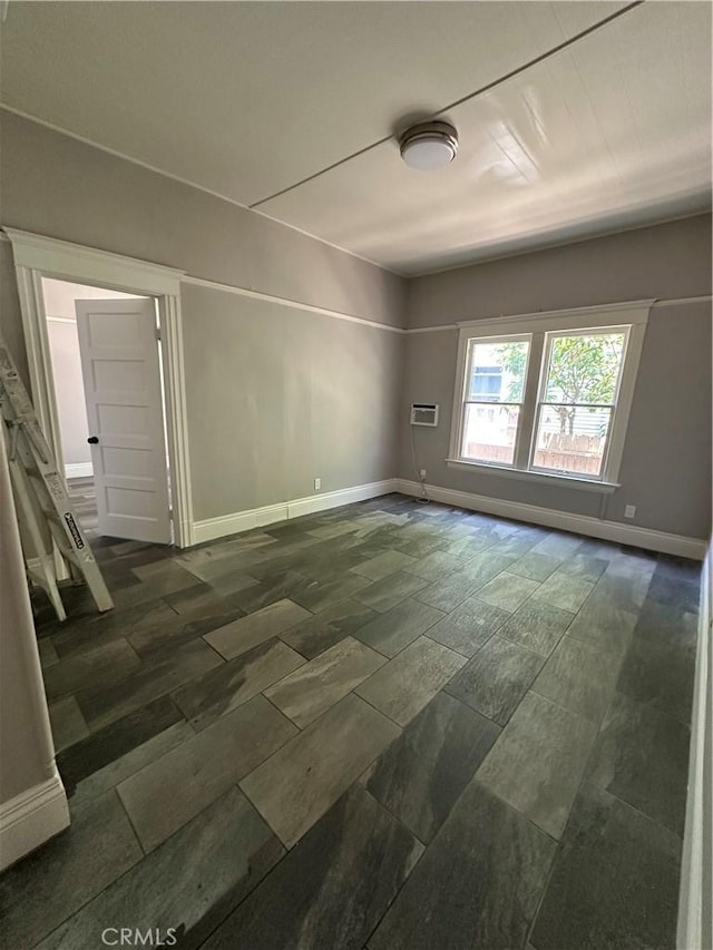 508 S Orange Ave, Santa Ana, CA 92701 - empty room with dark stone finish flooring and an AC wall unit