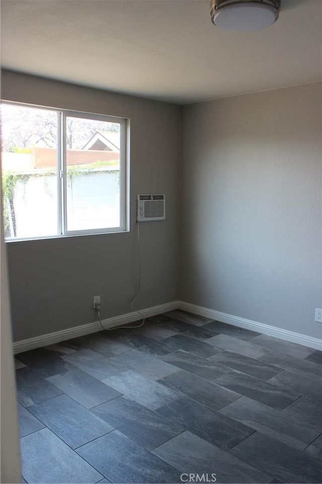 508 S Orange Ave, Santa Ana, CA 92701 - empty room with baseboards and a wall mounted air conditioner