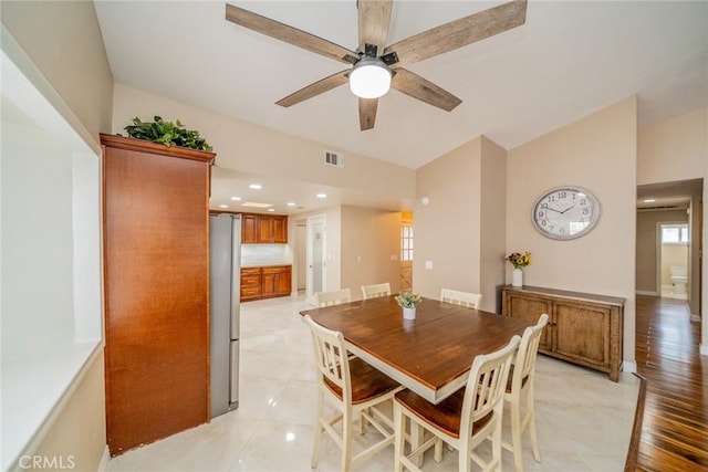18210 Deauville Dr, Victorville, CA 92395 - dining area with ceiling fan, vaulted ceiling, and plenty of natural light