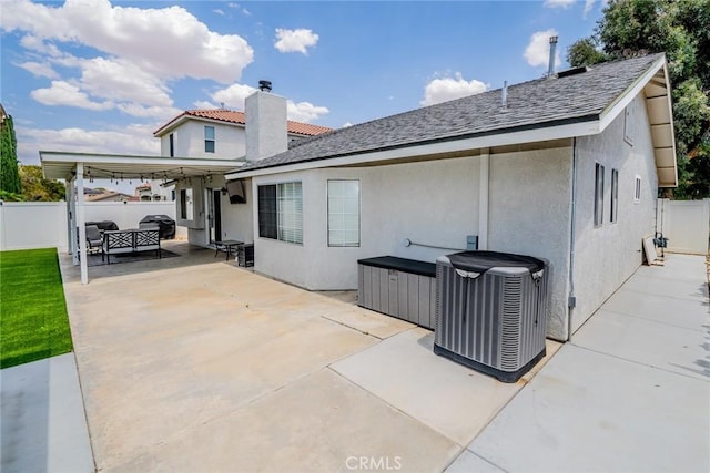 18210 Deauville Dr, Victorville, CA 92395 - back of property with a patio, a fenced backyard, stucco siding, and an outdoor hangout area