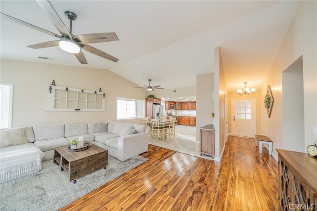 18210 Deauville Dr, Victorville, CA 92395 - living area with light wood-style floors, lofted ceiling, a chandelier, and a ceiling fan