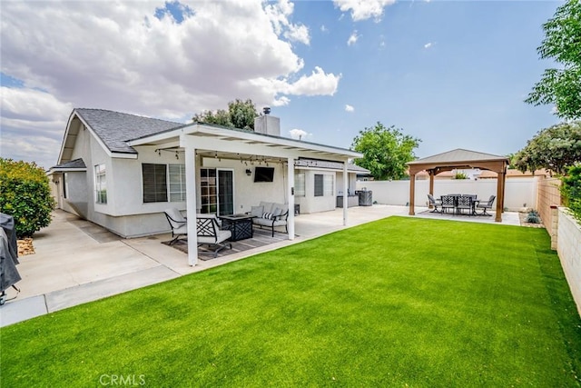 18210 Deauville Dr, Victorville, CA 92395 - rear view of property with a gazebo, a fenced backyard, a patio, a chimney, and stucco siding