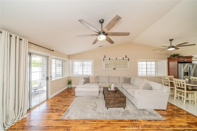 18210 Deauville Dr, Victorville, CA 92395 - living area featuring ceiling fan, wood finished floors, and lofted ceiling