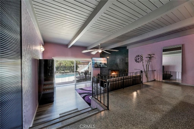2120 N Rose St, Burbank, CA 91505 - living area featuring beamed ceiling, speckle patterned floor, and ceiling fan