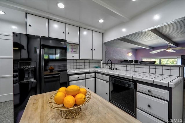 2120 N Rose St, Burbank, CA 91505 - kitchen with black appliances, beam ceiling, white cabinetry, a peninsula, and tasteful backsplash