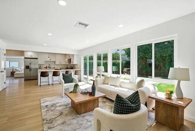 305 Spruce St, Chula Vista, CA 91911 - living room with light wood-style flooring and recessed lighting